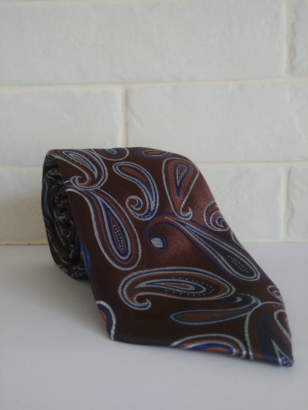 Montebello Italia 100% silk tie golden brown and blue paisley pattern